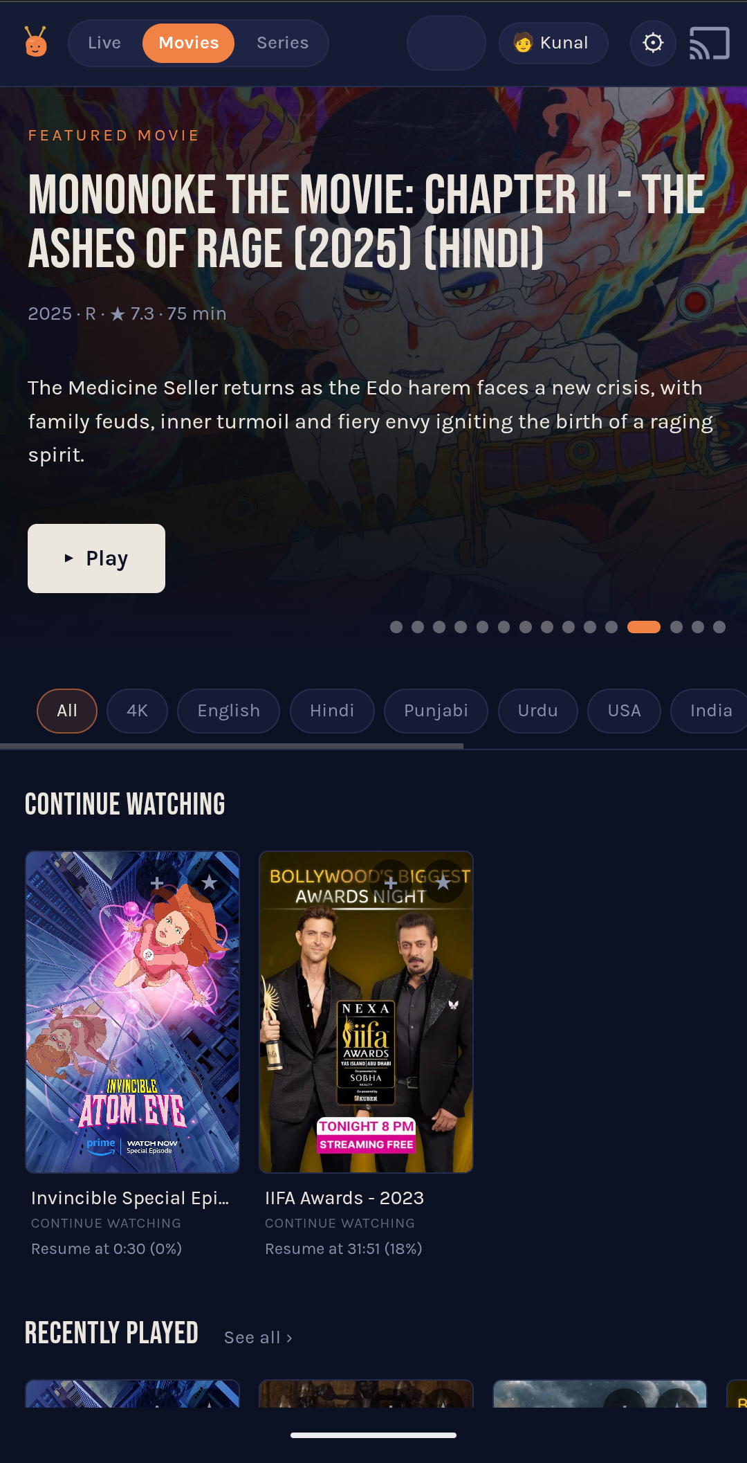 The movies page on a phone. A TMDB-enriched featured hero up top — title, year, rating, runtime, synopsis, play button. Language and quality chips across the middle. A Continue Watching shelf at the bottom with resume-position percentages.